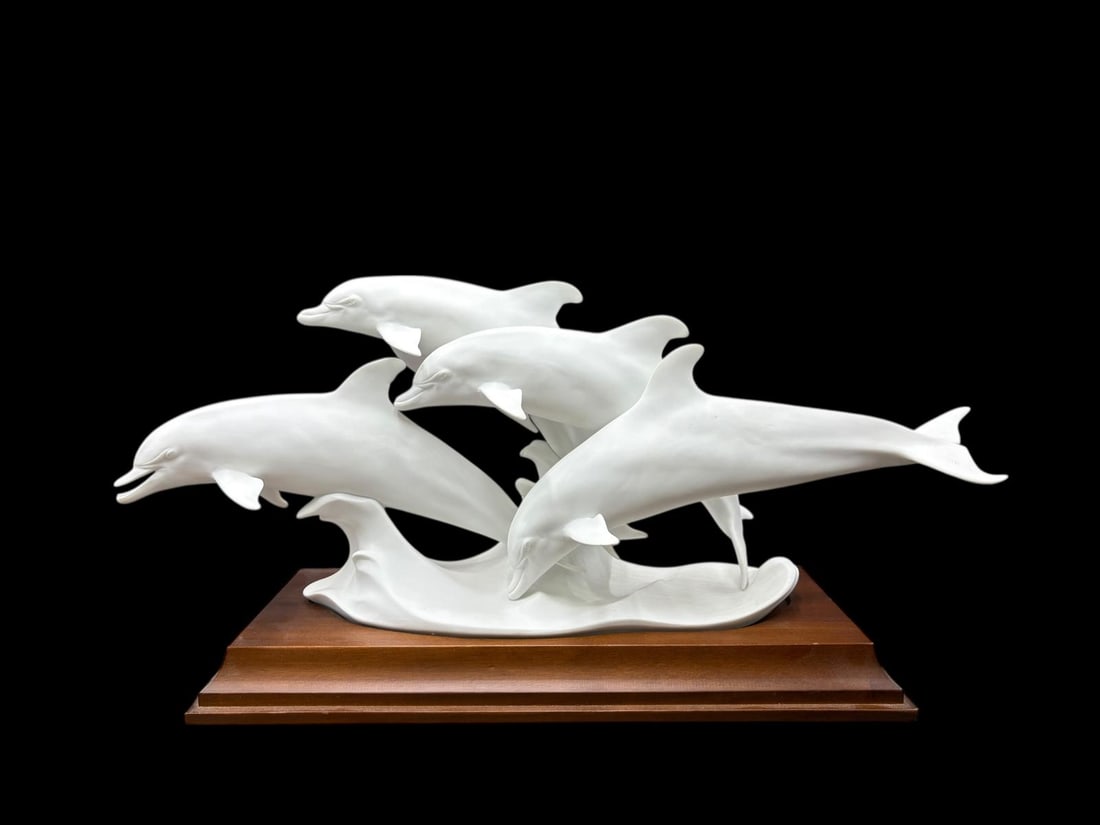 Kaiser Porcelain Germany 1980's Porpoises / Dolphins Signed Limited Ed #54645 Sculpture: Kaiser Porcelain Germany 1980's Porpoises / Dolphins Signed Limited Ed #54645 Sculpture. This is a group of 4 white Porpoises / Dolphins on a wave, porcelain bisque sculpture on a wood base. There was