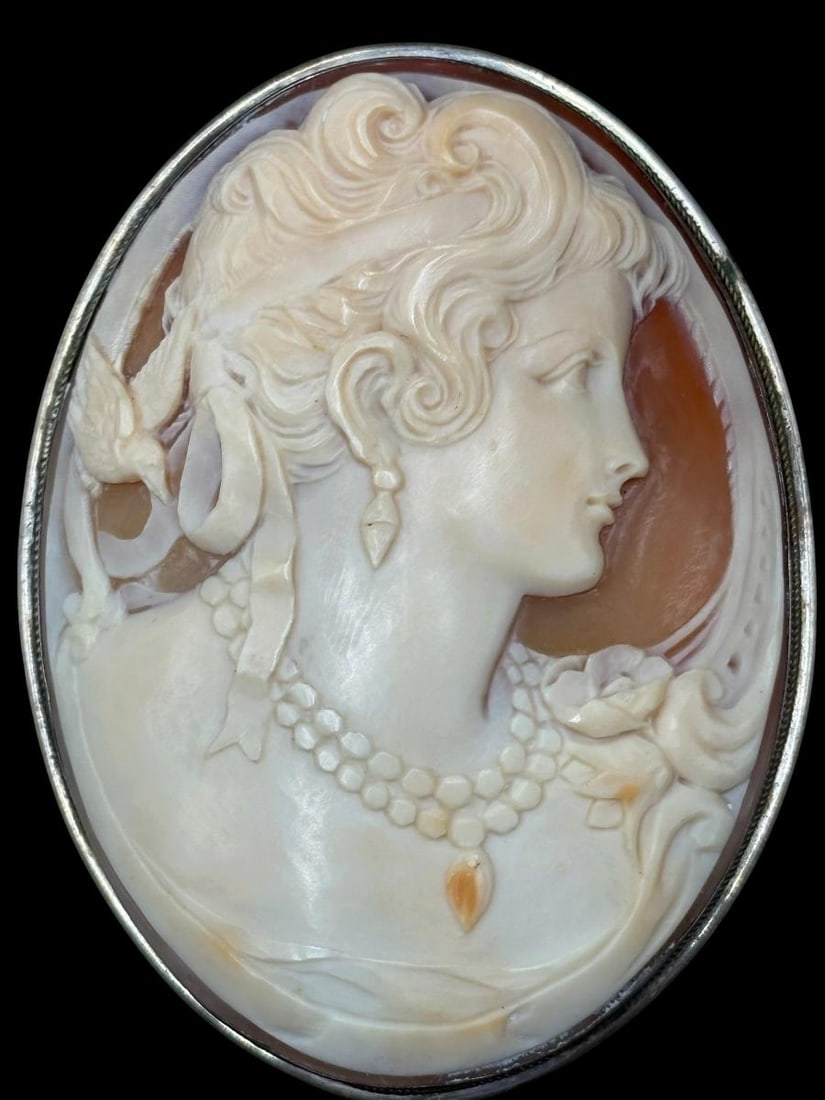 Antique 800 Sterling Silver Cased Cameo Brooch or Necklace Pendant: Antique 800 Sterling Silver Cased Cameo Brooch or Necklace Pendant. Gorgeous large carved cameo encased with 800 silver. No damage to the piece. Oval in shape, measures H 2 7/8" x W 2 1/4" and the wei