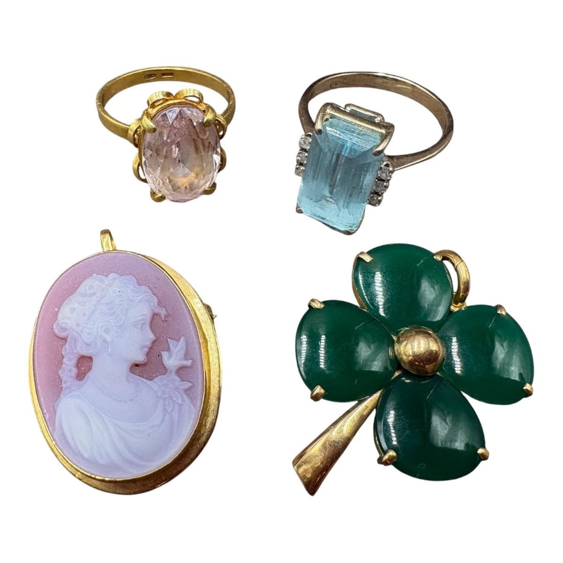 Estate Lot of Assorted 18k and Stone Rings & Brooches (4 pcs) 19.55 grams total with stones: Estate Lot of Assorted 18k and Stone Rings & Brooches (4 pcs). 1). 18k ring with pink stone, marked 750. 2). 18k white gold ring with emerald cut aquamarine stone. Marked 750. 3). Cameo Brooch with 18