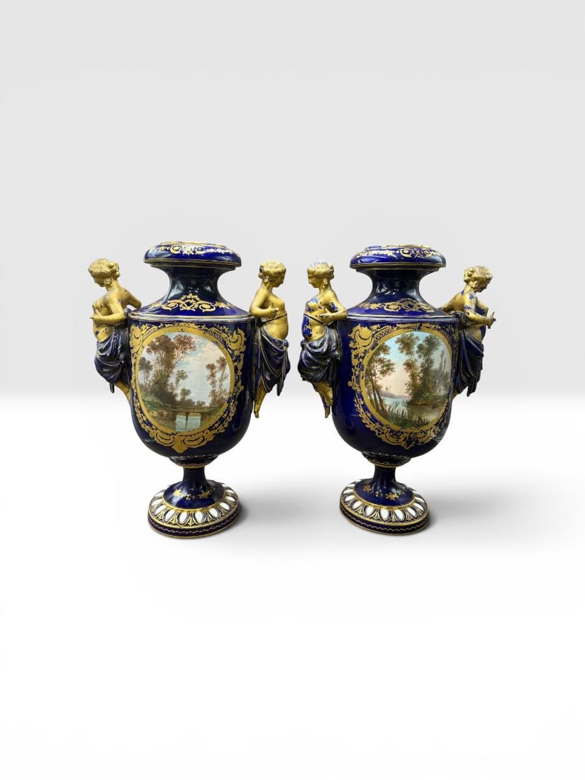 Antique French Sevres Style Signed Porcelain Hand Painted Urns: Antique French Sevres Style Signed Porcelain Hand Painted Urns. This is a wonderful pair of painted 2 sided and signed blue cobalt and gilt gold urns, featuring Greek Goddesses' on the side handles. T
