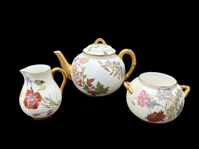 Royal Worcester 3pc Tea Set Teapot, Sugar & Creamer with Gilt Bamboo Handles: Royal Worcester 3pc Tea Set Teapot, Sugar & Creamer with Gilt Bamboo Handles. This is a wonder set from Royal Worcester in a hand painted floral and gilt design consisting of a small teapot wit lid 6"