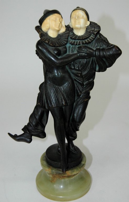Peter Tereszczuk, Austrian Bronze Couple: Peter Tereszczuk, Austrian bronze of dancing couple in Pierrot costumes, ivory faces, standing on round onyx base, very good condition. 11H.
