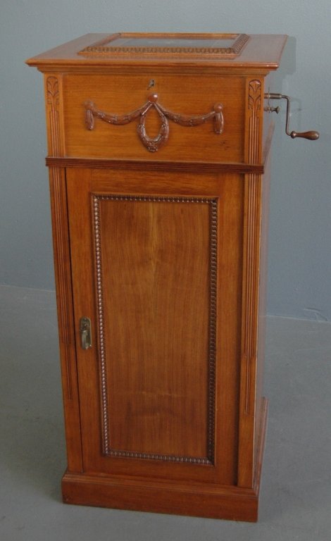 Polyphon Disc Player with Discs: Polyphon disc player, cherry cabinet with Arts & Crafts design inlay on lid and interior lid. Disc size is 14.5". Comb has all teeth intact and 12 bell section, plays beautifully. 41.5H, 19.5 square. 