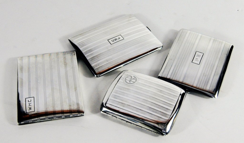 Four Sterling Silver Cigarette Cases: each in very good condition with springs intact, monogrammed. 12 troy ounces.