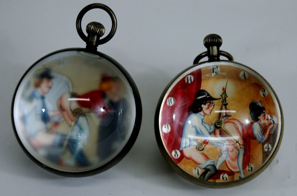 2 Doxa Paperweight Clocks: showing erotic scenes of men and women. Both working and graphic. One is somewhat cloudy and could be taken apart and cleaned.