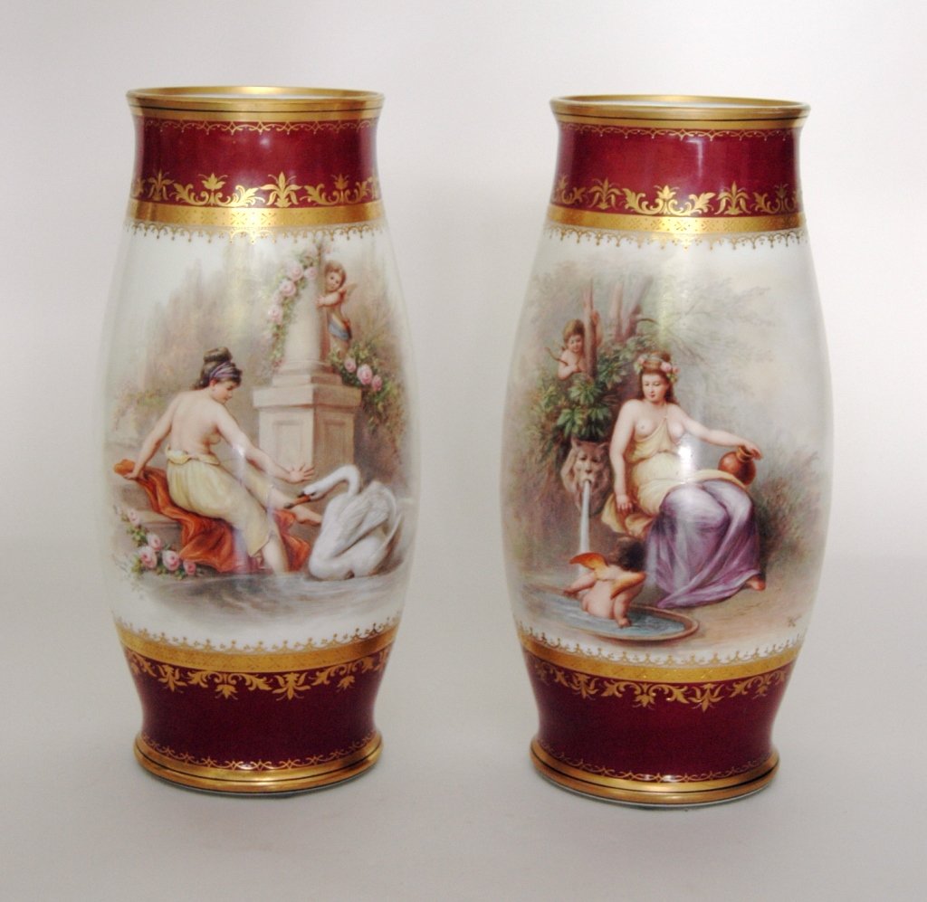 Pair German Glass Mantle Vases: artist signed by Joseph Ahne, hand painted with Grecian scenes of ladies and winged cherubs, burgundy banded top and bottom and gold stenciling. Mint condition. 14.5 tall.