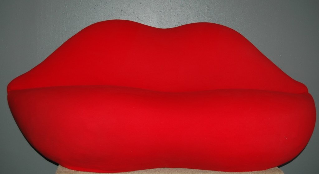 Studio 65 Marilyn Sofa: lip shaped in solid red polyester slip covered upholstery and foam construction. Made in Italy by Gufram. From original owner's estate. 3 tiny holes in fabric. 34H, 80L, 26D.
