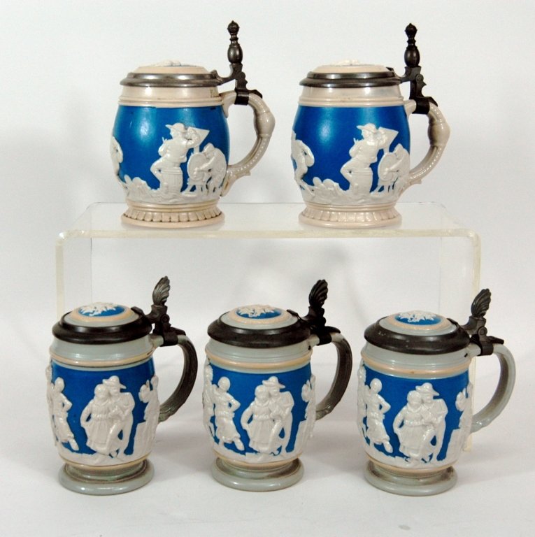 5 Mettlach, Villeroy & Boch Steins: 5 Mettlach, Villeroy & Boch steins: all cameo relief. .25 L with ceramic and pewter lids. 2- #2211, 3- #2086. All good condition.