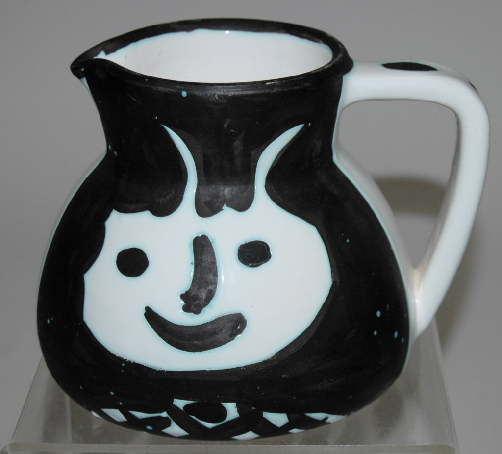 Pablo Picasso, 1881-1973 Pitcher: Pablo Picasso, 1881-1973, earthenware pitcher, c . mid-1950s, white gloss background with whimsical faces painted on unglazed portion of surface. Marked "Edition Picasso Madoura" with impressed marks
