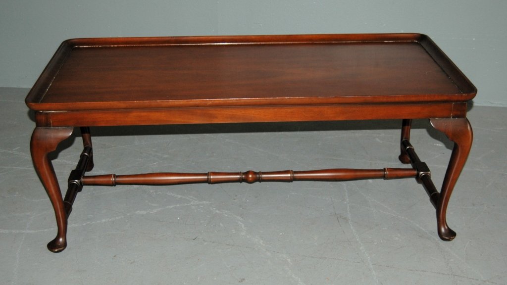 Kittenger Colonial Williamsburg Table: Kittenger Colonial Williamsburg Queen Anne coffee table. Solid mahogany. Kittenger, Buffalo paper label and "W" Williamsburg Adaptation burned in stamp. Very good condition. 46 x 23 x 18.
