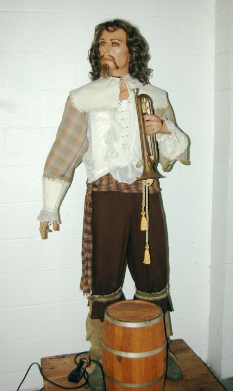 Life Size Automaton Pirate: Life size automaton pirate. 6'1" pirate with bugle, standing on rolling platform, in costume with oak keg accessory. Working and moving. Split to flesh on bugle hand, otherwise good condition.