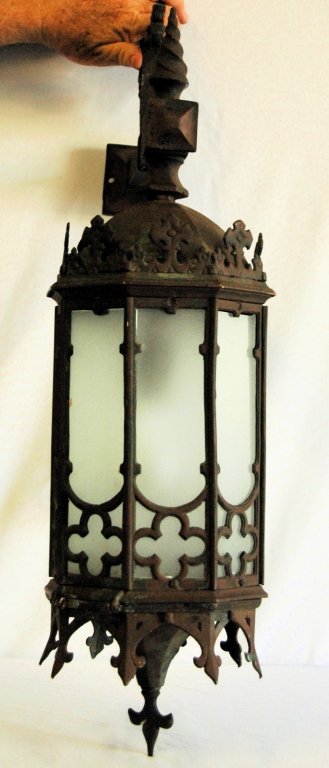 Bronze Gothic Style Porch Lantern: Bronze Gothic style porch lantern. Heavy gauge metal fixture with 8 sides of frosted translucent glass. Good condition, ready to hang. Extends 15" from wall mount, 32 H.