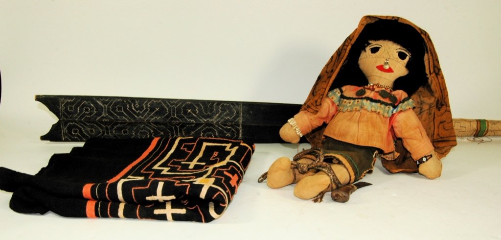 4 South American Ethnographic Items: 4 South American ethnographic items of Cashibo origin of Peru. Hand made doll, 17" in native outfit. Native skirt with design 26 x 48 (wrap style) on course black cloth. A "Poking Stick" to ward off b