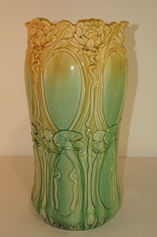 Art Nouveau Pottery Umbrella Stand: Art Nouveau pottery umbrella stand, c. 1905, Majolica glaze of green and yellow, certainly Ohio Valley origin, very good condition. 21.5 h.