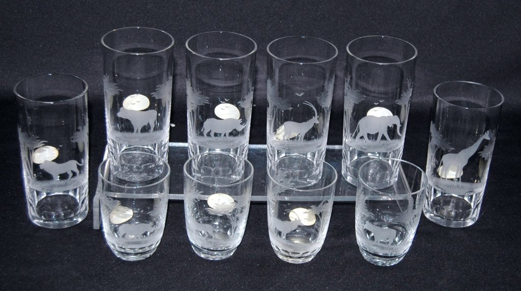 Queen Lace African Kenya Series Crystal: Queen Lace, African Kenya series, etched crystal. 6 highball tumblers each with different animal; giraffe, elephant, gazelle, rhino, water buffalo and lion and 4 rocks glasses with water buffalo, gaze