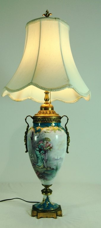 Sevres, France, Porcelain Lamp: Sevres, France, porcelain table lamp, scenic panels by artist R. Petit, gilded bronze ormolu mounted, very good condition, signed with cartouche mark and "S", 24" to socket, 34" overall.