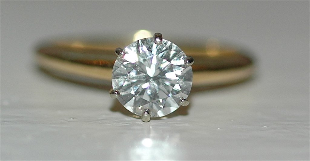 Diamond Solitaire Ring: Diamond solitaire ring, .96 carat, I-1 clarity, H color, 18K yellow gold with 6 prong setting, 2.80 grams of gold, 50% depth, size 6. GIA verbal assessment.