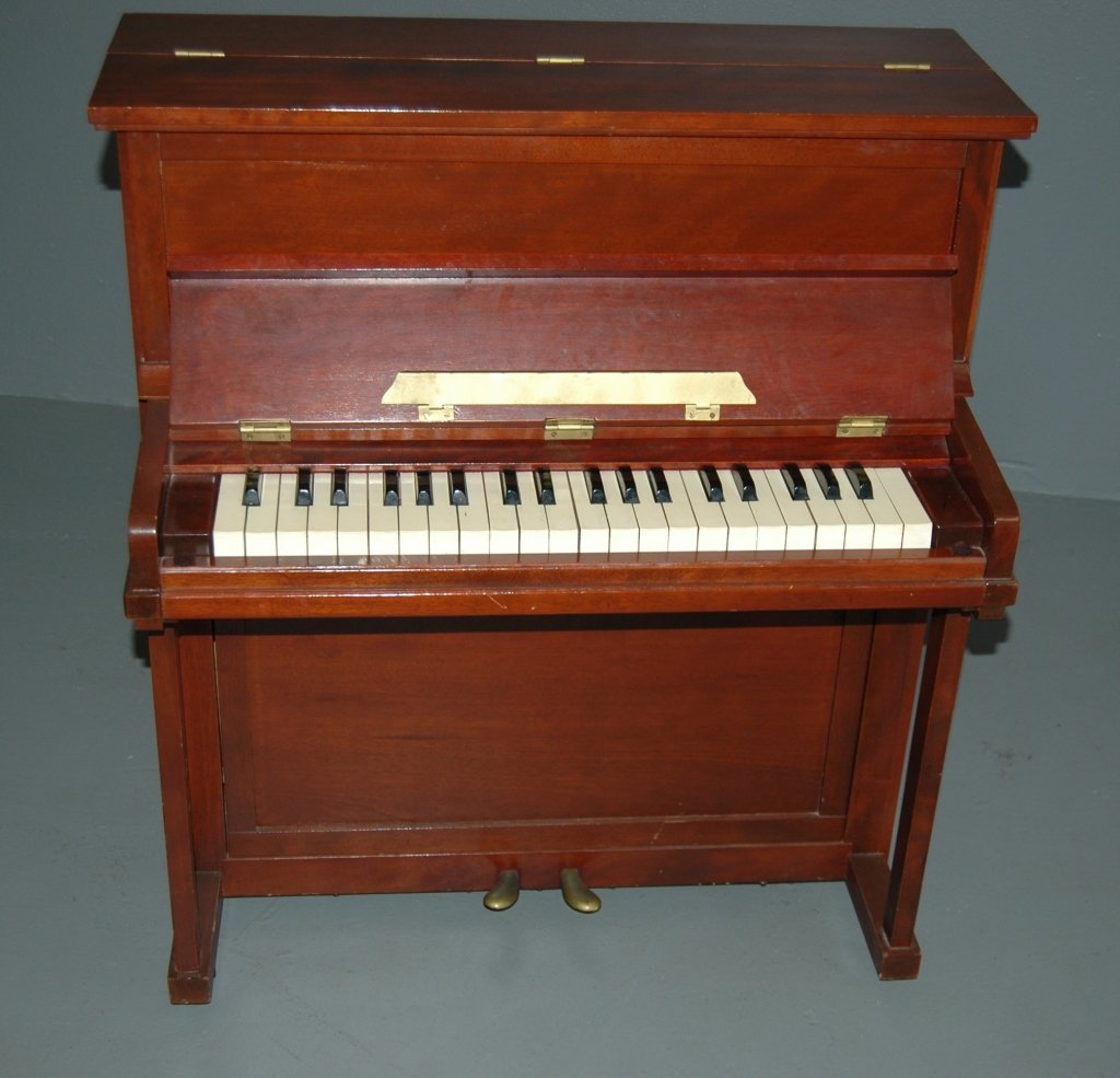 Croft Antique Student Piano: Rare Croft Antique student, beginner or miniature upright piano in mahogany case (salesman sample). Real piano sound with 40 keys, 2 pedals, 3 octave range. Hinged key cover and top. Extremely rare in