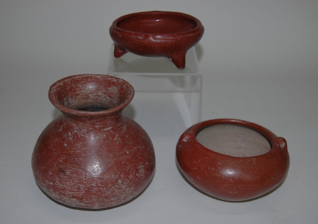 Group 3 Pre-Columbian Colima Pottery Vessels: Group of 3 pre Columbian red slip Colima pottery vessels. Largest 5.5 x 6.5 with outturned 4" rim. 2.5 mouth, good condition showing wear usage. Small highly polished tri-pod bowl, 5.25 x 2.25H, 2 sma