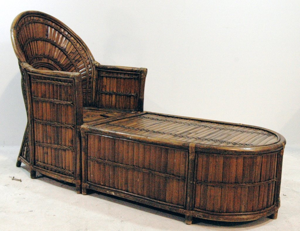 Rattan Chaise Lounge: Rattan chaise lounge once belonging to Charlie Chaplin, descended through estate of Phyllis Thaxter estate, c. 1930s. 2 secret compartments for storage. Complete with cushion and stain. Structurally s