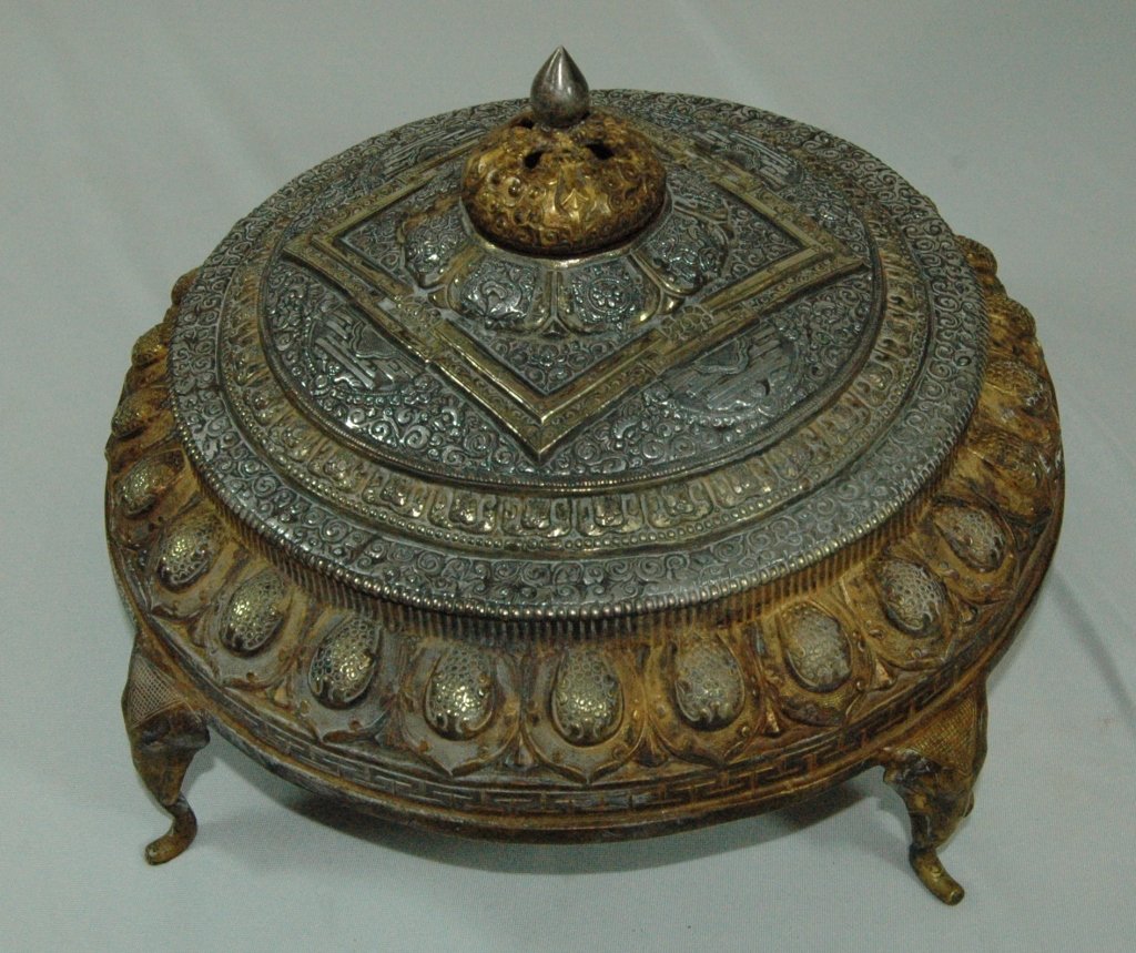 Tibetan Mandala Altar: Tibetan Mandala altar, bronze, gold and silver metals, circular body on 4 legs, has copper plate (loose) bottom and unattached finial. 13" x 6"h. Good condition.