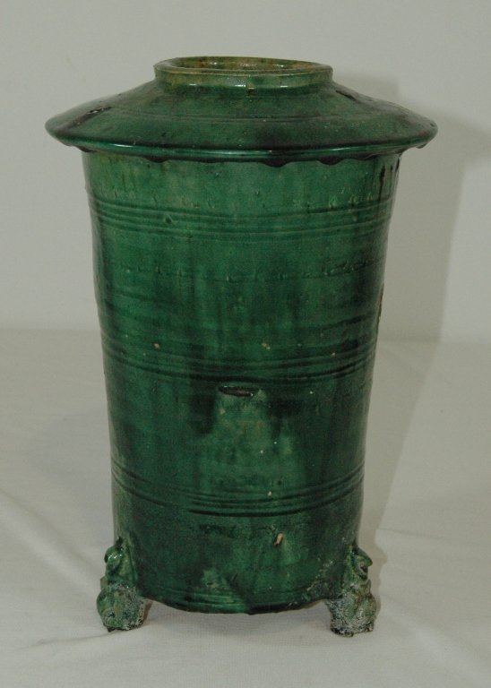 Han Dynasty Glazed Rice Keeper: Han Dynasty green glazed pottery rice keeper, c. 206 BC-220 AD, etched decoration around opening and body, on 3 feet. Some minor chipping at edges. 12"h.