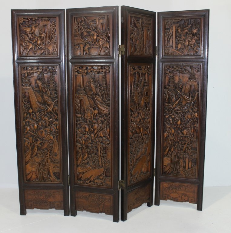 4 Panel Chinese Screen: Deeply carved 4 panel Chinese screen, c . 1950, 12 sections depicting battle scenes, dark hardwood frame, backside is plain raised panels, good condition with very minor loss of a couple of points on 