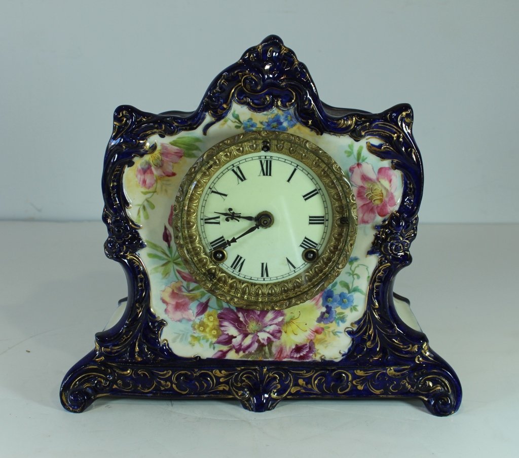 Ansonia Clock in Royal Bonn Case: Ansonia clock in Royal Bonn, Germany, porcelain floral decorated case "La Lorne", 11" x 12" x 5", very good condition.