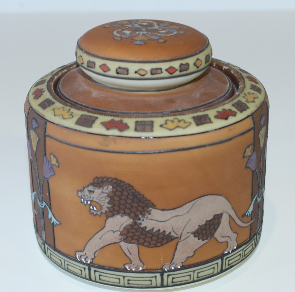 Nippon Decorated Porcelain Humidor: Nippon decorated porcelain humidor, burnt orange body with encircling lions. Great condition, 5.5" x 5.5".