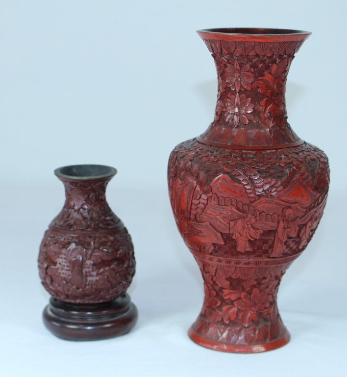 Two Cinnabar Vases: Two Cinnabar vases, one lacquer baluster vase, late 19th century, good condition (tiny paint flecks easily removed), 9". Other a smaller, deep red cinnabar vase, metal rim, on stand, 4", good conditio