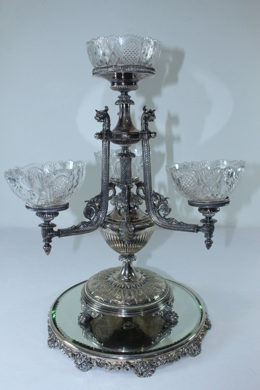 English Silverplate 4 Arm Epergne: English silverplate 4 arm epergne with figural pedestal center. Dated December 17, 1864, no other visible hallmarks but certainly Sheffield, 4 cut glass bowls rest in arms, with top bowl possible repl