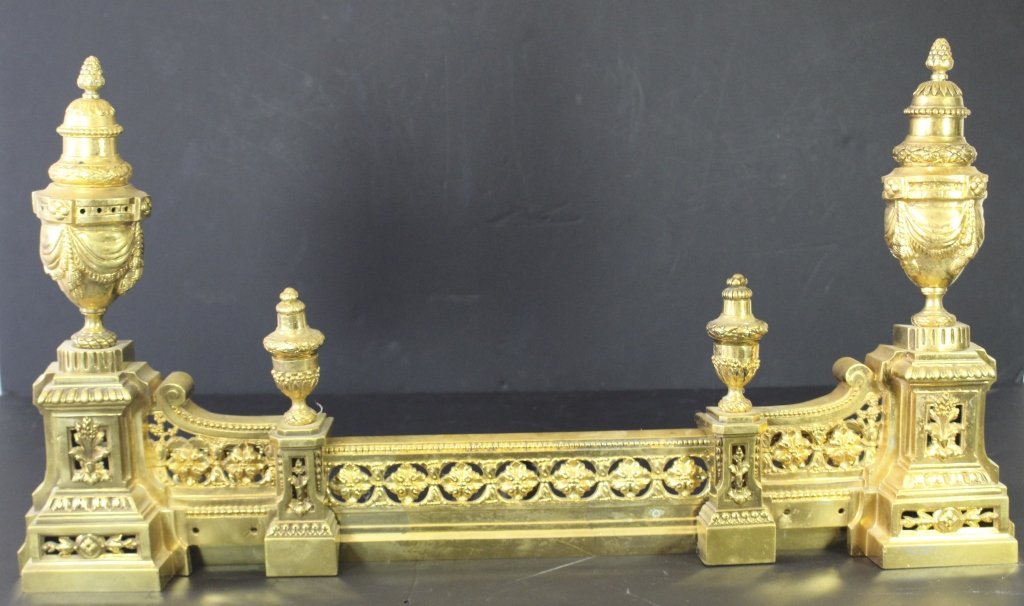 French Gilt Metal Fire Fender: French gilt metal adjustable fire fender, urn ends with sliding middle. Adjust to 44" wide, good condition. 3 pieces.