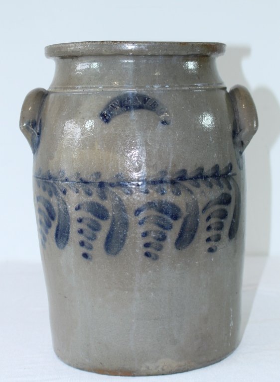 J. Weaver, Stoneware Crock: J. Weaver, Beaver, Pa. blue decorated 4 gallon stoneware crock, hanging foliage off straight line vine, signed, good condition with minor roughness on one ear handle and underside rim chip, 14".