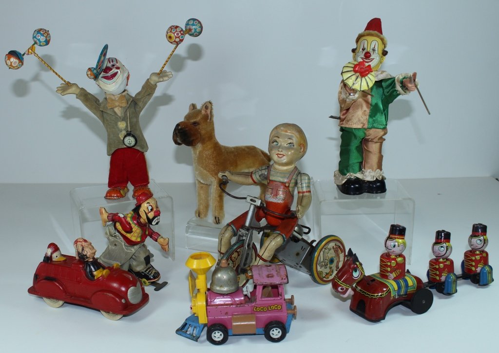 Group of Vintage Toys: Group of vintage toys; Unique Art Co. " Kiddy Cyclist", Stieff Boxer, Sun Rubber Co. Disney fire truck, Tippy the Clown wind-up, clown skater wind-up, Topper locomotive, Mikuni train, clown juggler wi