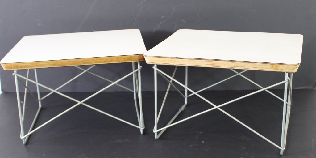 Pair Eames for Herman Miller LTR Tables: Pair of 1970s Eames Herman Miller occasional LTR tables, chrome wire base, white laminate tops over wood. 10"h x 15" x 13.5". Minor roughness to edges, scratches, but in very good shape. Mislabeled, n