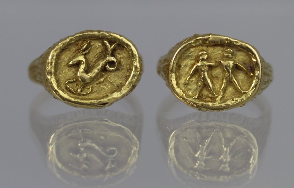 Two 18K Zodiac Rings signed Tiffany & Co.: Two 18K yellow gold Zodiac rings Gemini and Taurus, signed Tiffany & Co. Italy, size 6. 10.2 dwt.