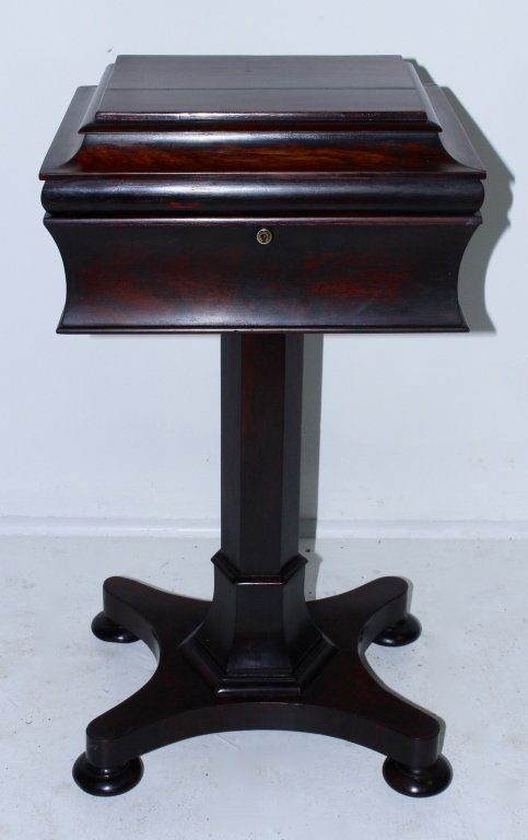 English Rosewood Tea Poy: English Rosewood tea poy on stand. Fine lines and curves on this 1840-50 example. Full interior covers and cut-outs, very good condition, 30.5" x 15" x 13".