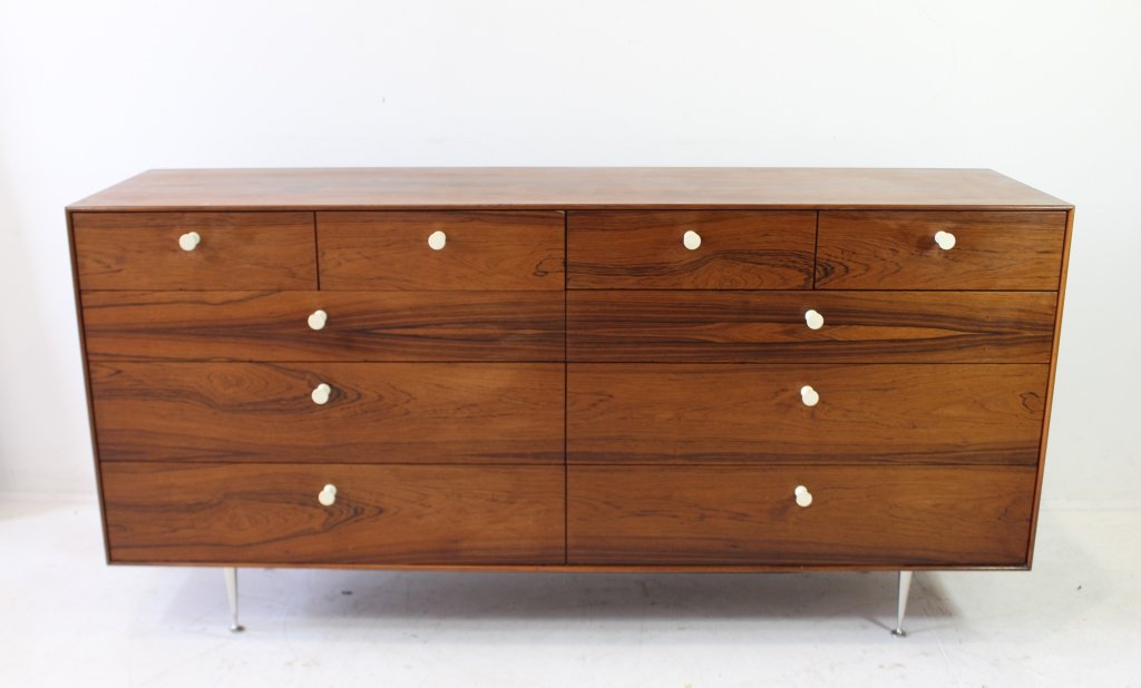 George Nelson for Herman Miller Cabinet: George Nelson for Herman Miller "Thin Edge" cabinet # 5723, c. 1950s, rosewood veneers, aluminum legs, with original drawer pulls, 67.5"w, 19.75"d, 32"h. Minor stains to top, 2 water rings, unsigned.