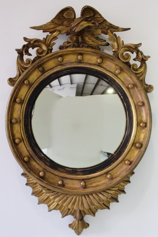 Federal Bullseye Mirror: Federal bullseye carved gilt wood mirror with eagle crest and 13 balls, 45" long, 25" diameter, finish shows age, c. 1830, and wear but intact.