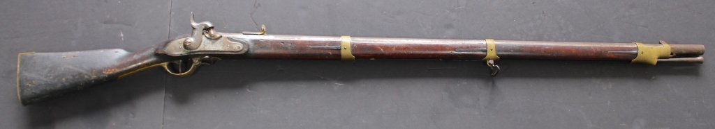 Prussian Military Rifle: Prussian military percussion cap and ball rifle, c. 1833. Marked "Suhl" (armory), "K" with Crown hallmark, original ramrod, matching serial numbers, bug damage to stock, 57" overall. Imported for Unio