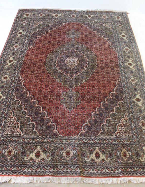 Tabriz Mahi Area Rug 6.8' x 9.7': Tabriz Mahi area rug, 6.8' x 9.7', 100% hand made wool, busy field with medallion center, good condition.