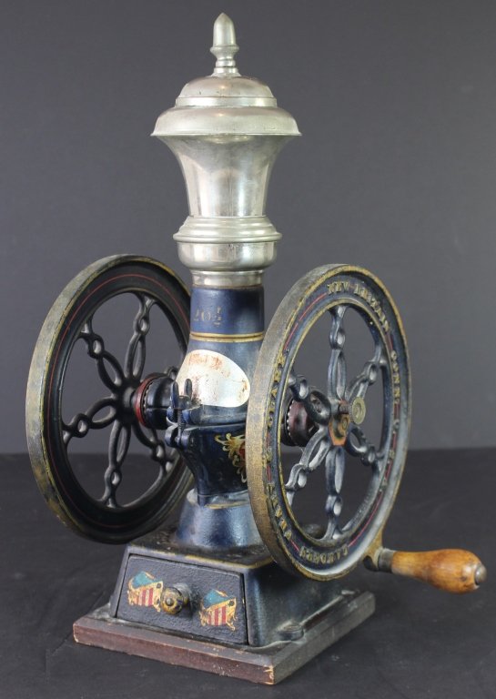 Landers, Frary & Clark Coffee Grinder: Landers, Frary & Clark, New Britain, Connecticut general store cast iron coffee grinder. Wooden crank, nickel plated top, original paint, "20 1/2" good condition, 18" tall with 8.5" wheels.