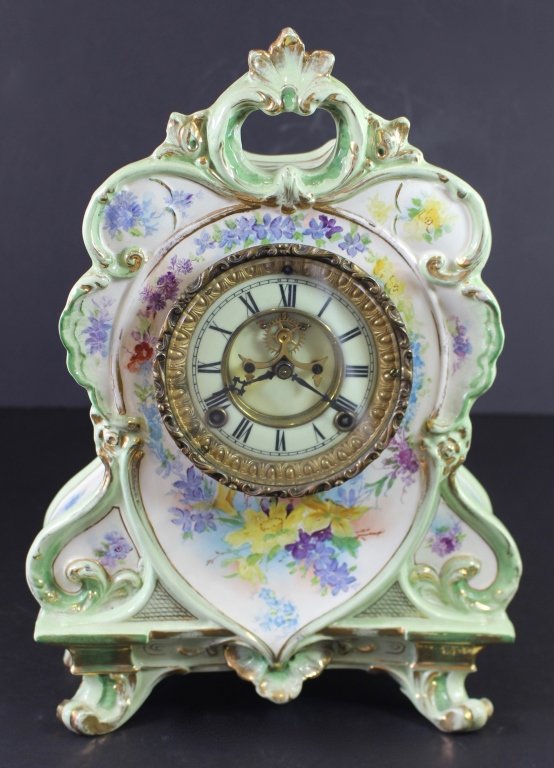 Ansonia Royal Bonn "La Roche" Clock: Ansonia Royal Bonn "La Roche" porcelain case mantle clock, c. 1895, gilt and floral decorated, signed Ansonia, open escapement works, Bonn mark on case, original key, 13.5" x 12.75" x 5.75". Great con