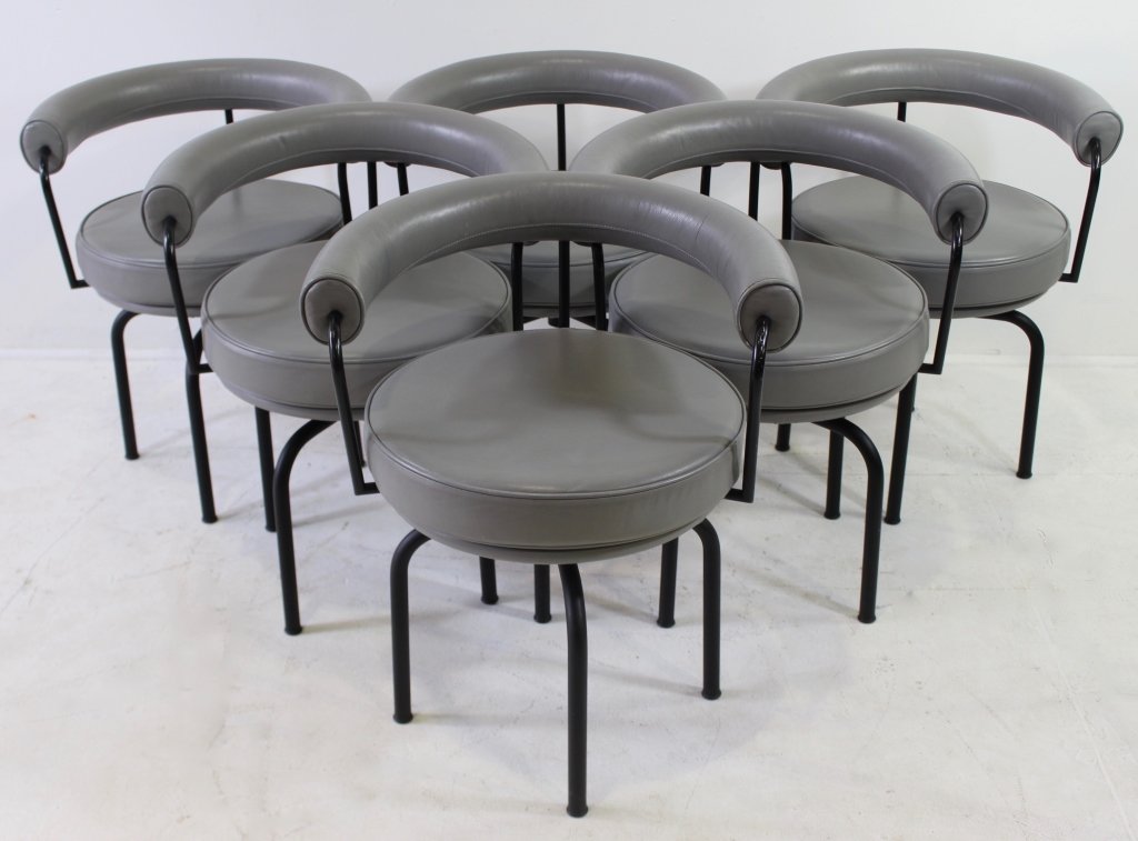 Six Le Corbusier Chairs "LeSeige Tourant": Six Le Corbusier chairs "LeSeige Tourant" shape B302, Cassina Furniture, Italy, c. 1986, gray leather upholstery with black metal tubular legs, swivel seats, 28" x 22" x 25". Signed, excellent conditi
