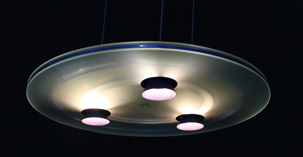 Pair Blue Aurora Modern Pendants by Arteluce: Pair of Blue Aurora pendants (chandeliers) designed by Santiago Miranda and Perry King, for Arteluce. 2-24" frosted and blue glass disc with 3-50 halogen bulbs, create a subtle and beautiful glow, adj