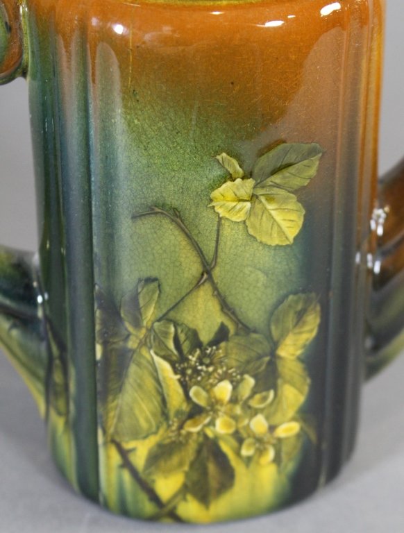 Rookwood Coffee Pot by Kataro Shirayamadani: Rookwood standard glaze coffee pot with yellow floral decoration by Kataro Shirayamadani, 1891. Marks on base include Rookwood logo, date, shape # 552, W for white clay, the artist's cipher and L for 