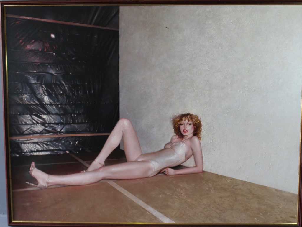 Martin Joseph Hoffman, 1935-2013: Martin Joseph Hoffman, 1935-2013. Important oil on canvas, photo realism, of his "American Woman Series", this being "Aggi" "78-79", young woman reclining on floor with high heels, image 80" x 60", fr