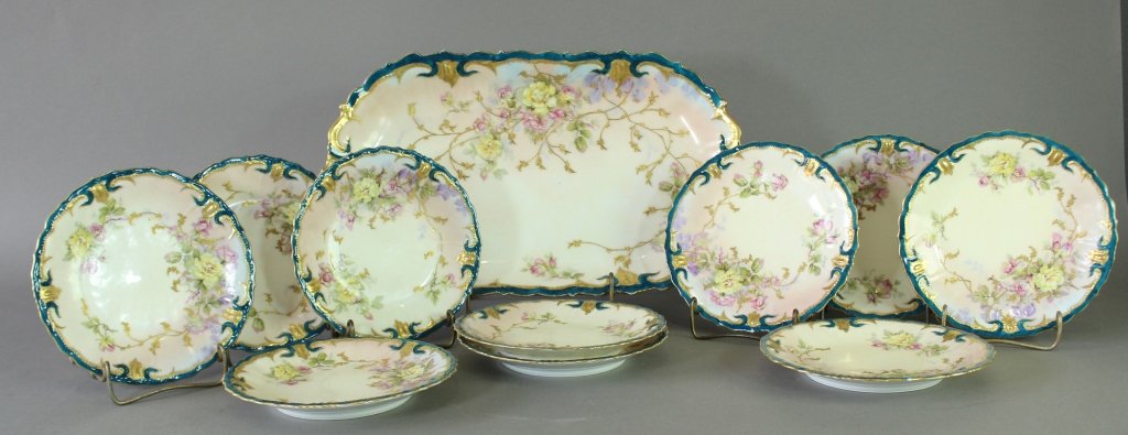 A. Klingenberg & Co. Limoges Ice Cream Set: A. Klingenberg & Co. Limoges, France, 11 piece ice cream service set. 16" x 9.25" platter with teal and gold border, rose and thorn hand painted decoration, with 10-7" matching plates, mint with virtu