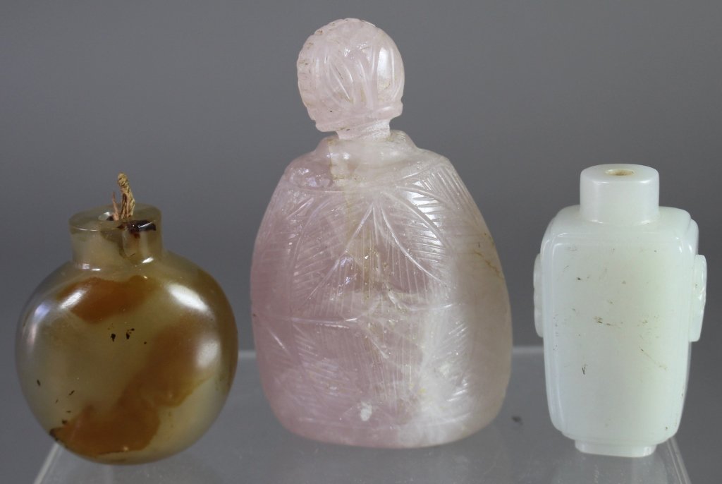 Three Chinese Snuff Bottles: Three Chinese snuff bottles: 3.5" carved rose quartz with stopper, 2.5" white jade, no stopper and 2.25" natural polished agate, no stopper.