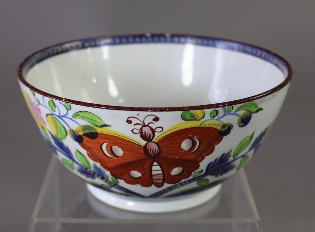 Gaudy Dutch Butterfly Bowl: Gaudy Dutch butterfly bowl, c. 1820, white background with blue rim border and multi-color butterfly decoration, 3" x 6.5", minor nicks and lines consistent with age and usage, very rare.
